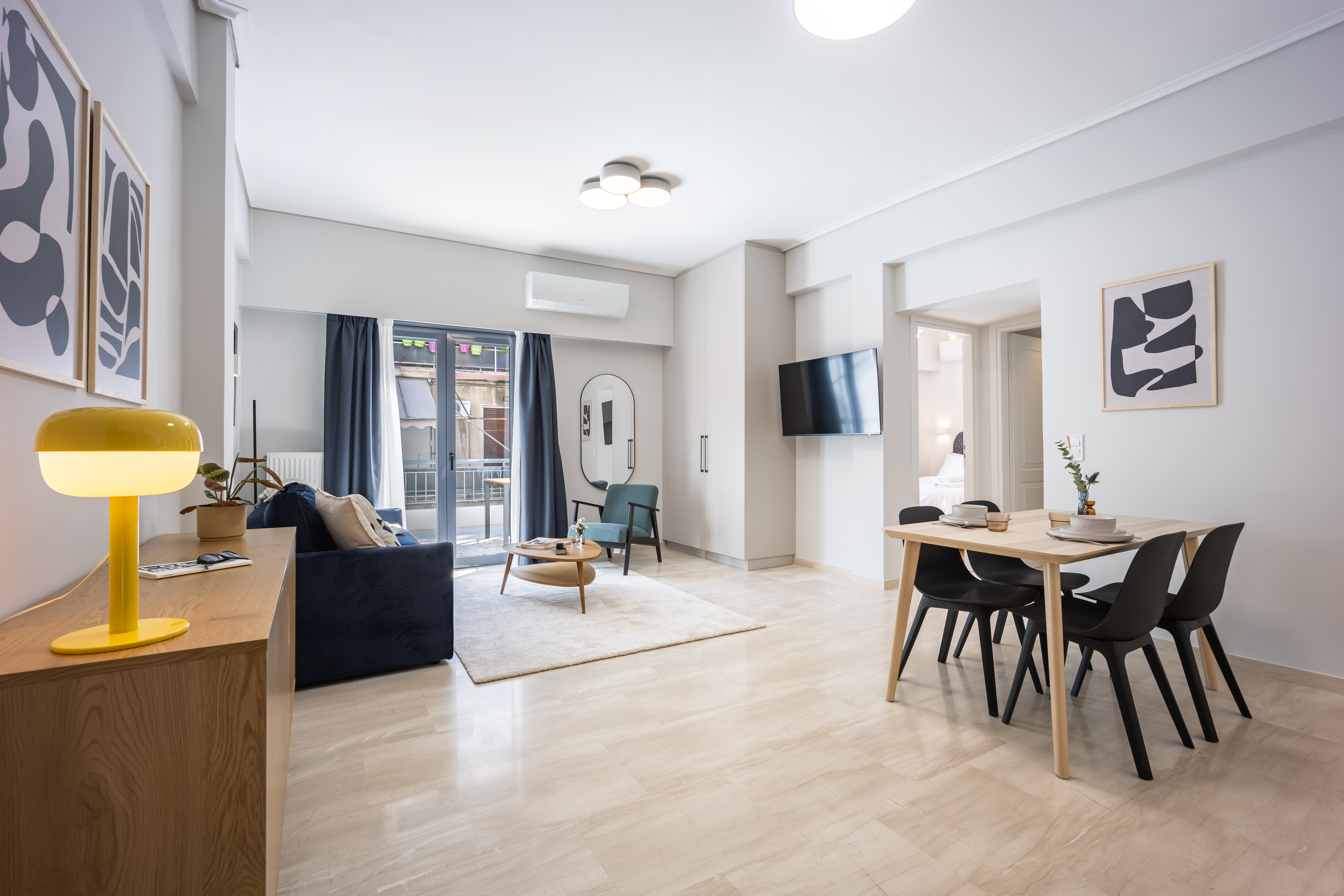 A wide, bright open-plan living and dining room